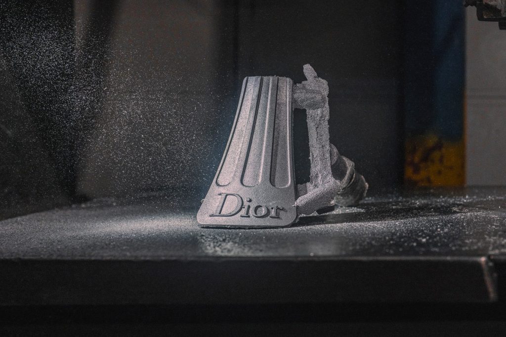 Dior window display by Alex Chinneck