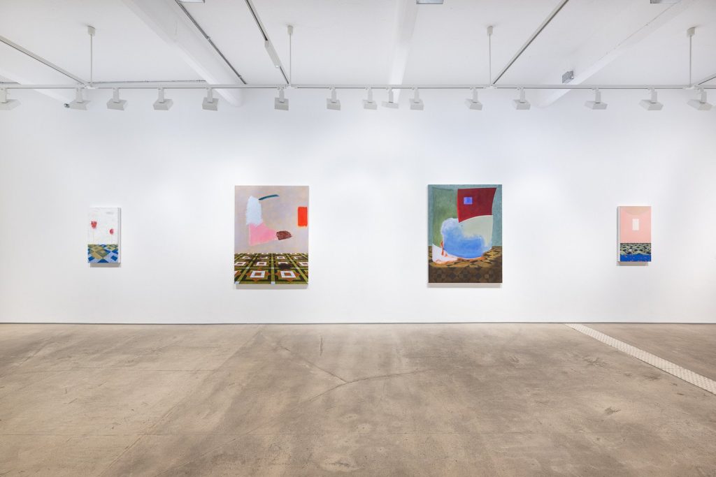 Ally Fallon paintings on a long gallery wall