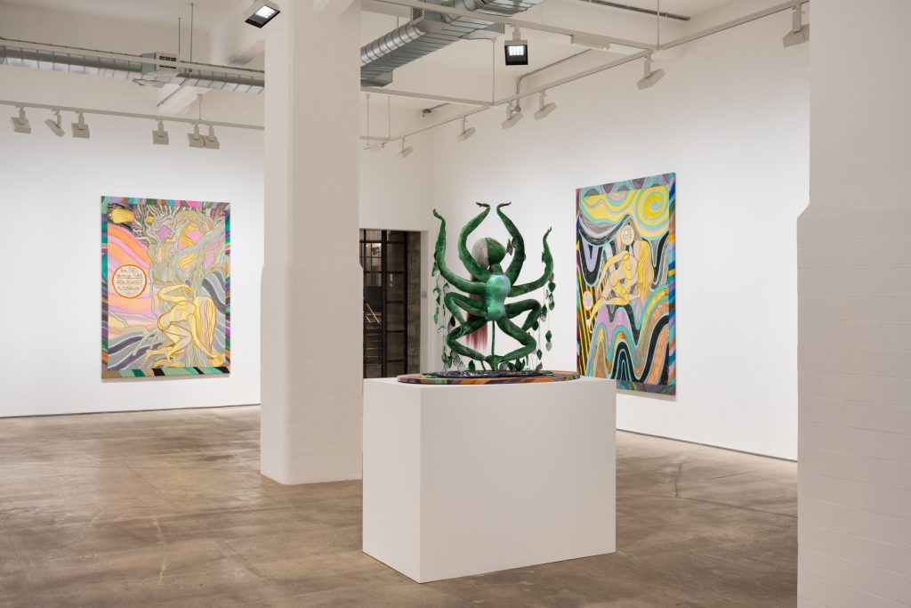 Emma Talbot sculpture between painted canvases