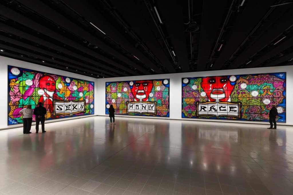 Three large Gilbert & George pictures on gallery walls