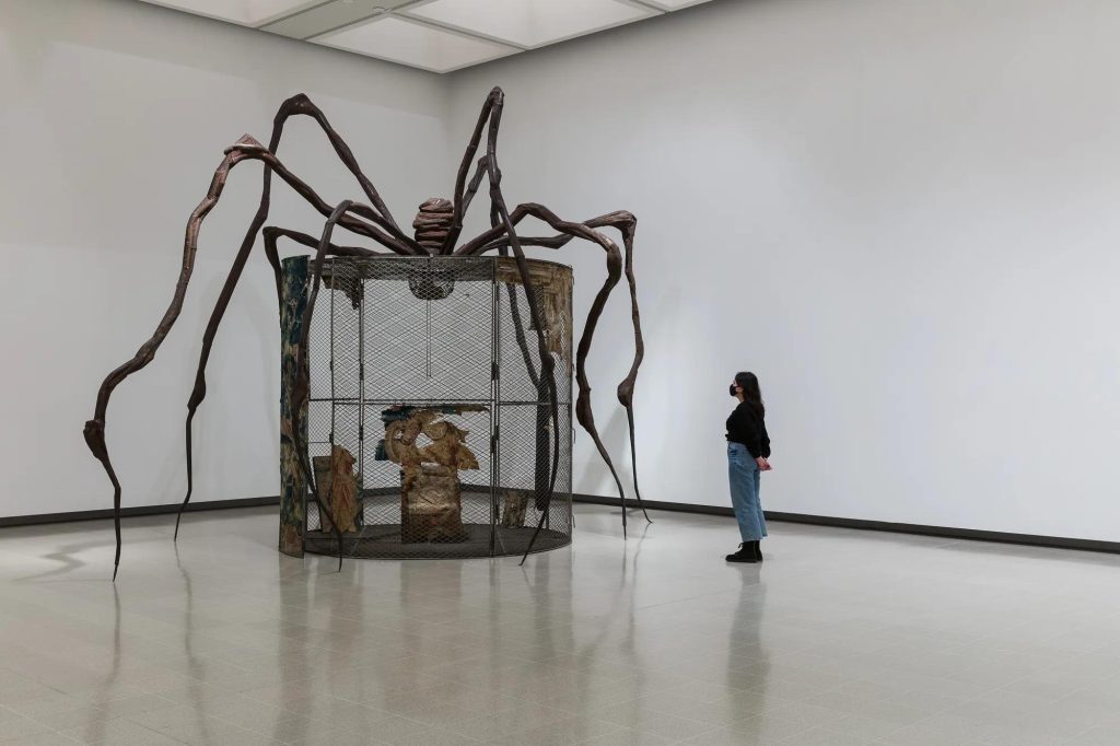 Louise Bourgeois spider sculpture over a cage