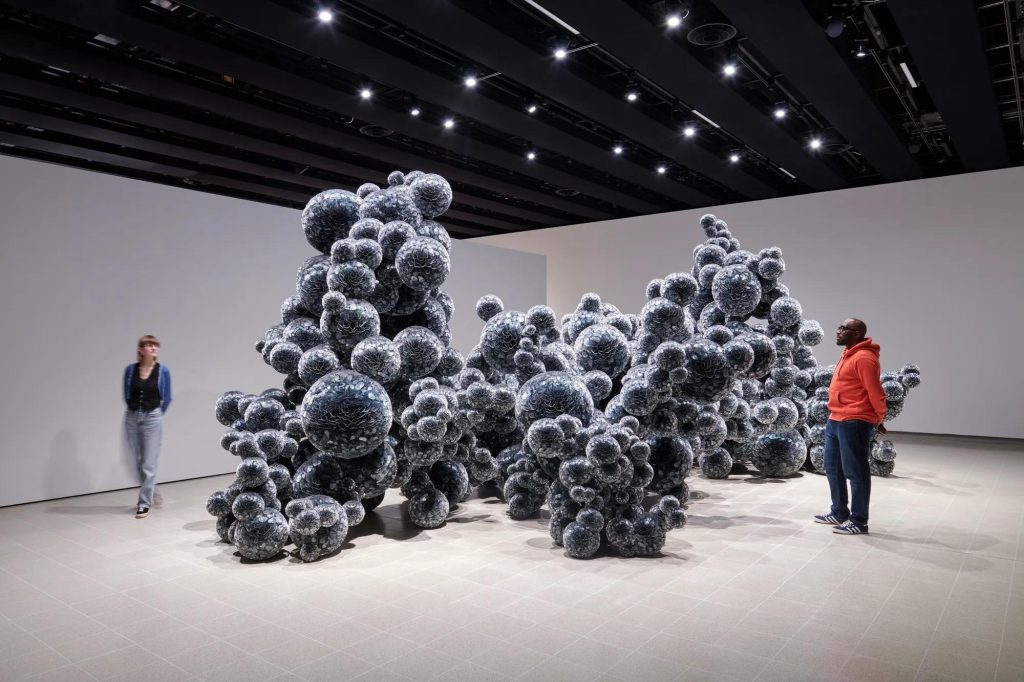 Black bubble-like sculpture by Tara Donovan