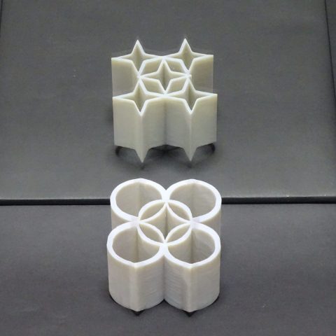 Star-shaped ambiguous cylinders by Kokichi Sugihara in front of a mirror