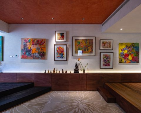 The Nest by Comma.Studio, a Hanoi apartment with paintings on a long white wall