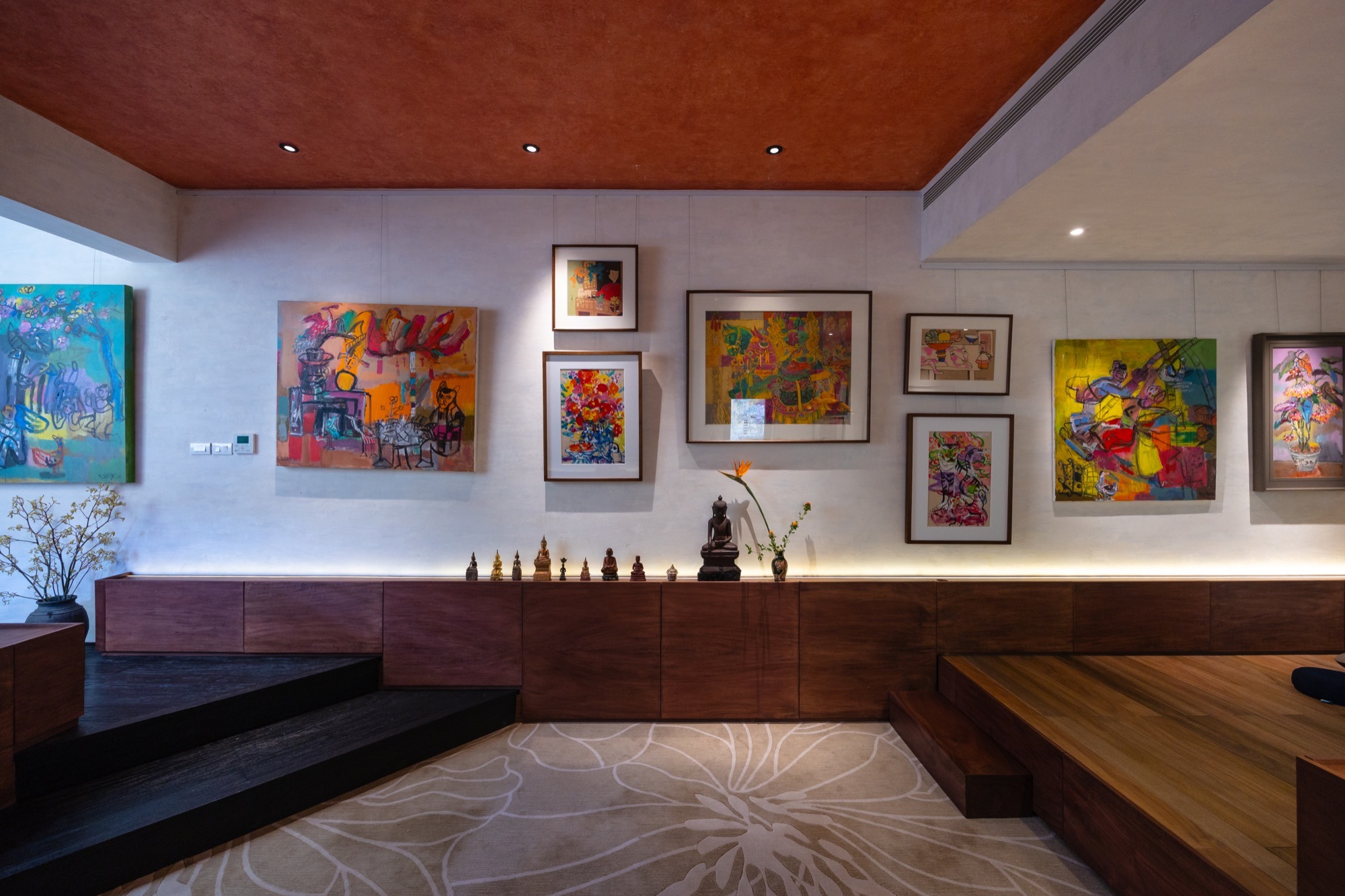 The Nest by Comma.Studio, a Hanoi apartment with paintings on a long white wall