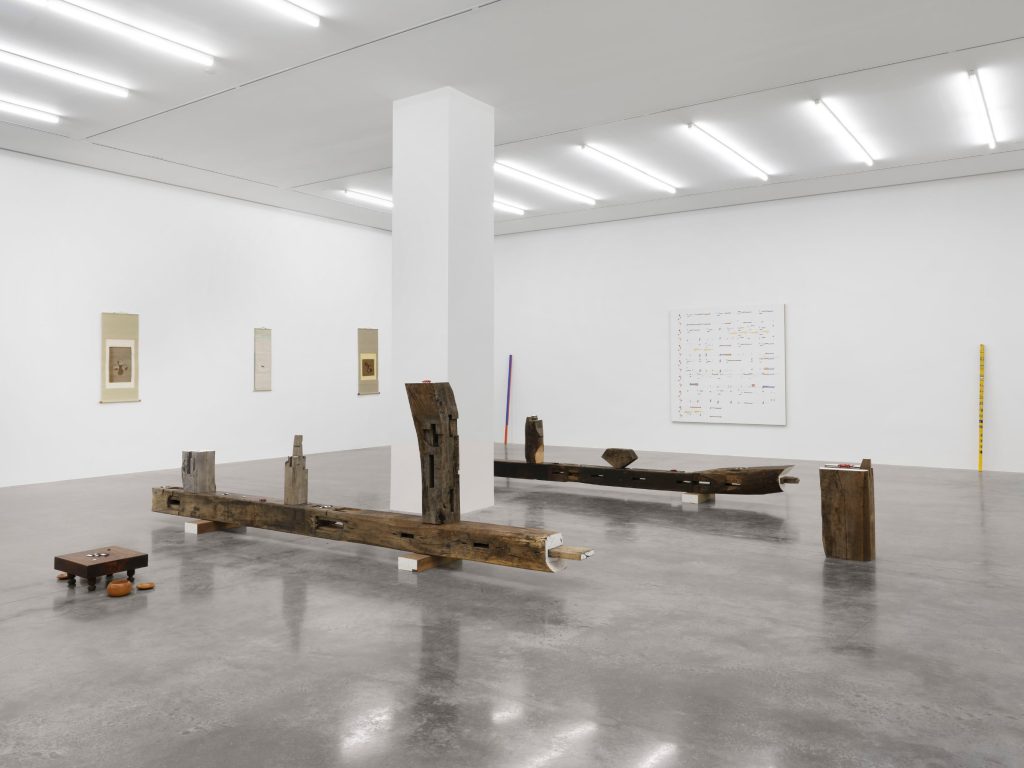 Timber pieces on the floor of a large gallery