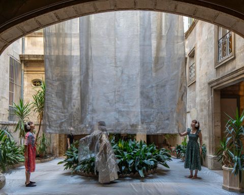 Liminality in Motion by Yurika Takemura seen through a courtyard arch in Montpellier