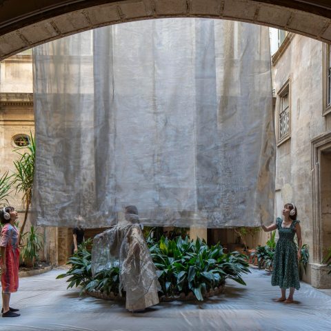 Liminality in Motion by Yurika Takemura seen through a courtyard arch in Montpellier